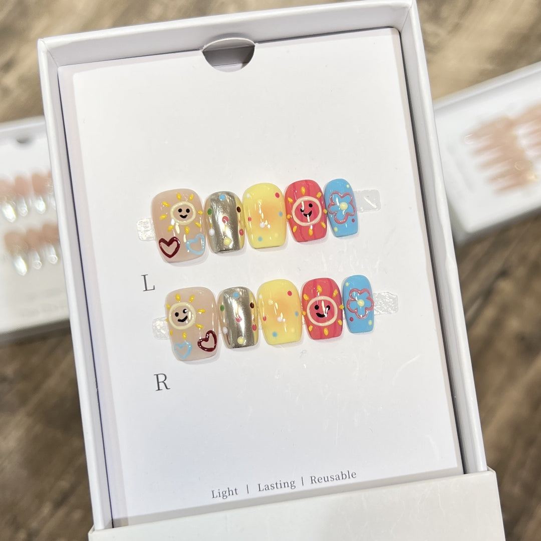 Whimsical Press-On Nail Art Set with Smiley Faces and Floral Designs Bowlift