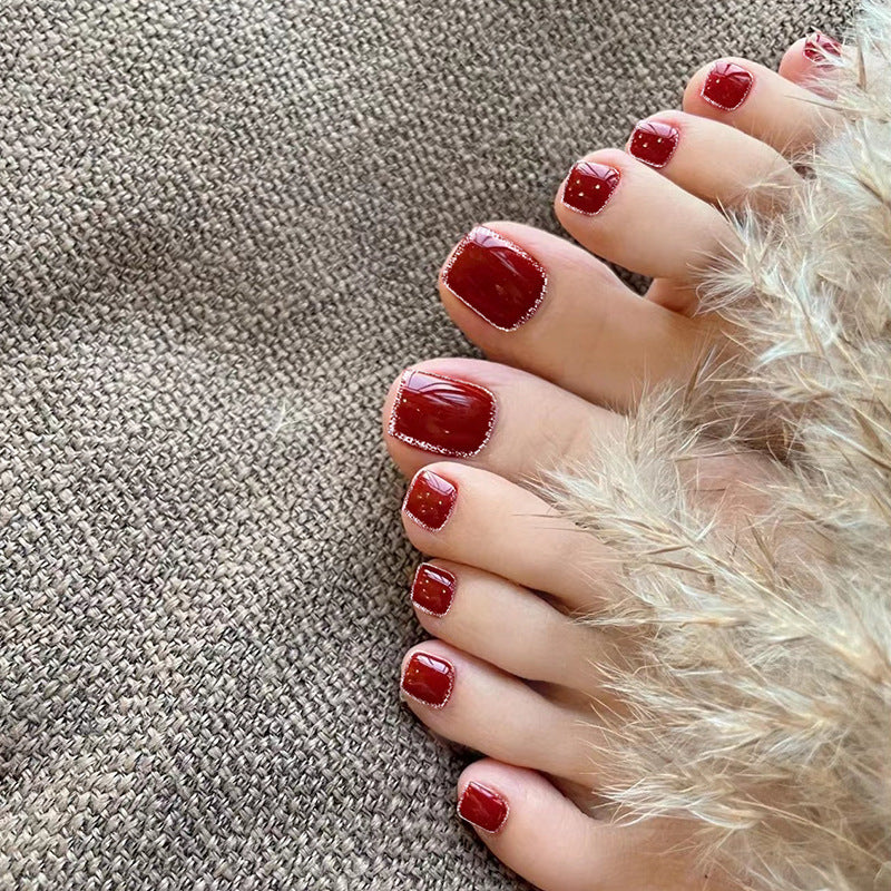 Artistic toenail art with rhinestone and glitter elements Bowlift