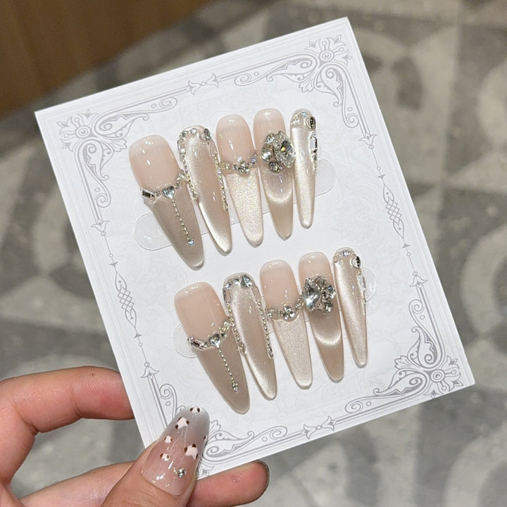 Glamorous nail tips with rhinestone and glitter effects Bowlift