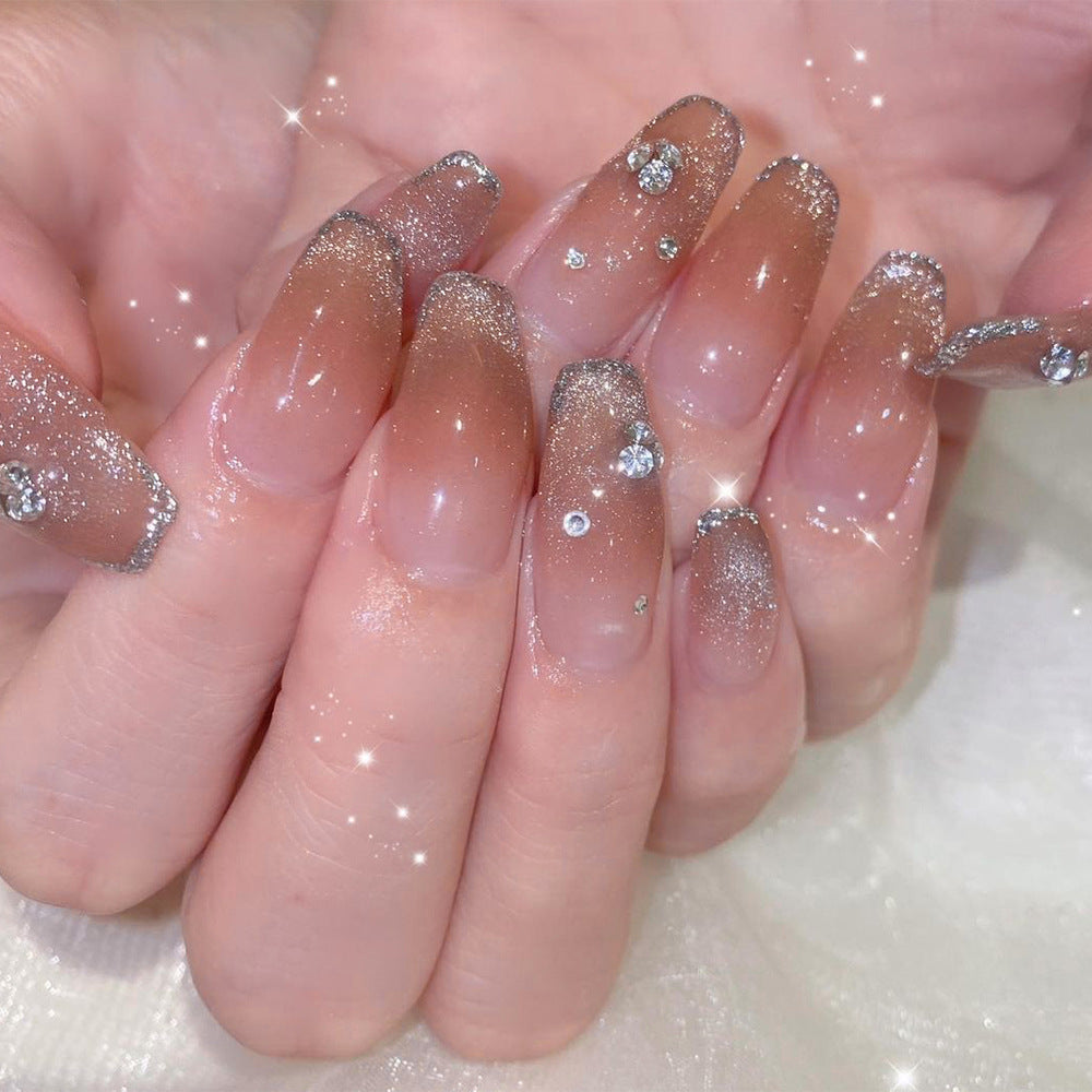 Glamorous artificial nails with glitter and rhinestone accents Bowlift