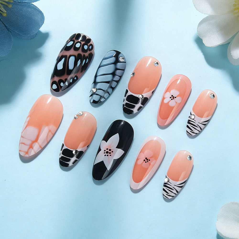 Artistic Press-On Nail Set with Floral and Textured Design Bowlift