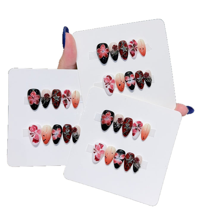 Art nail set with floral motifs and glitter accents Bowlift