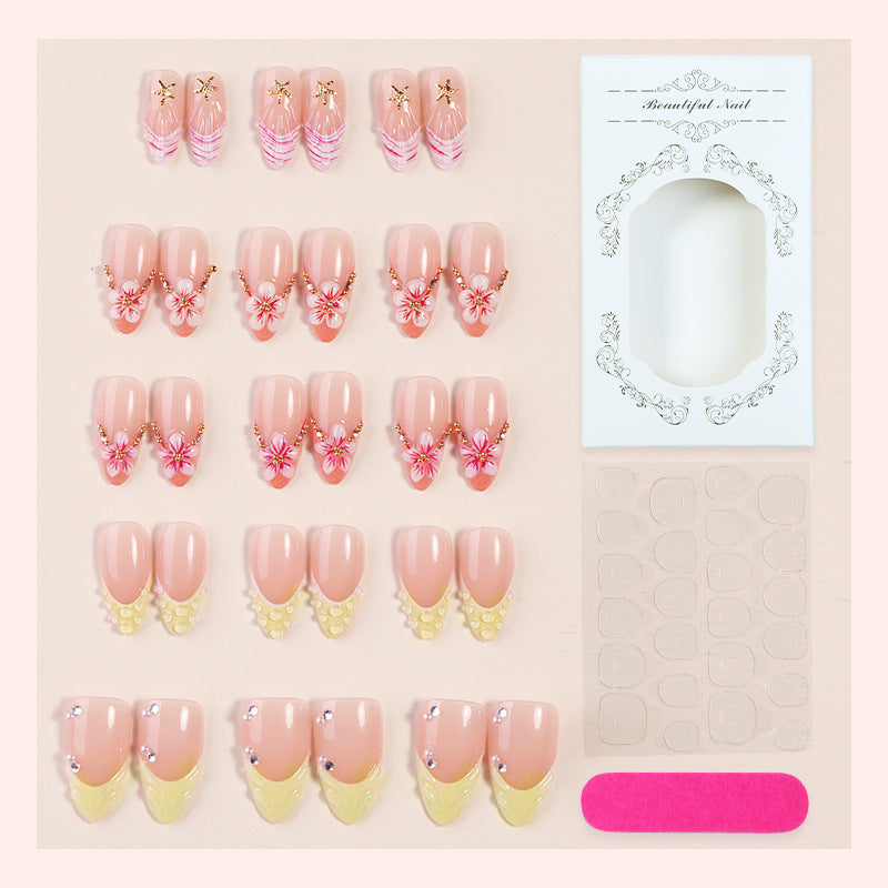 Artificial nail set with glamorous floral and glitter decorations Bowlift