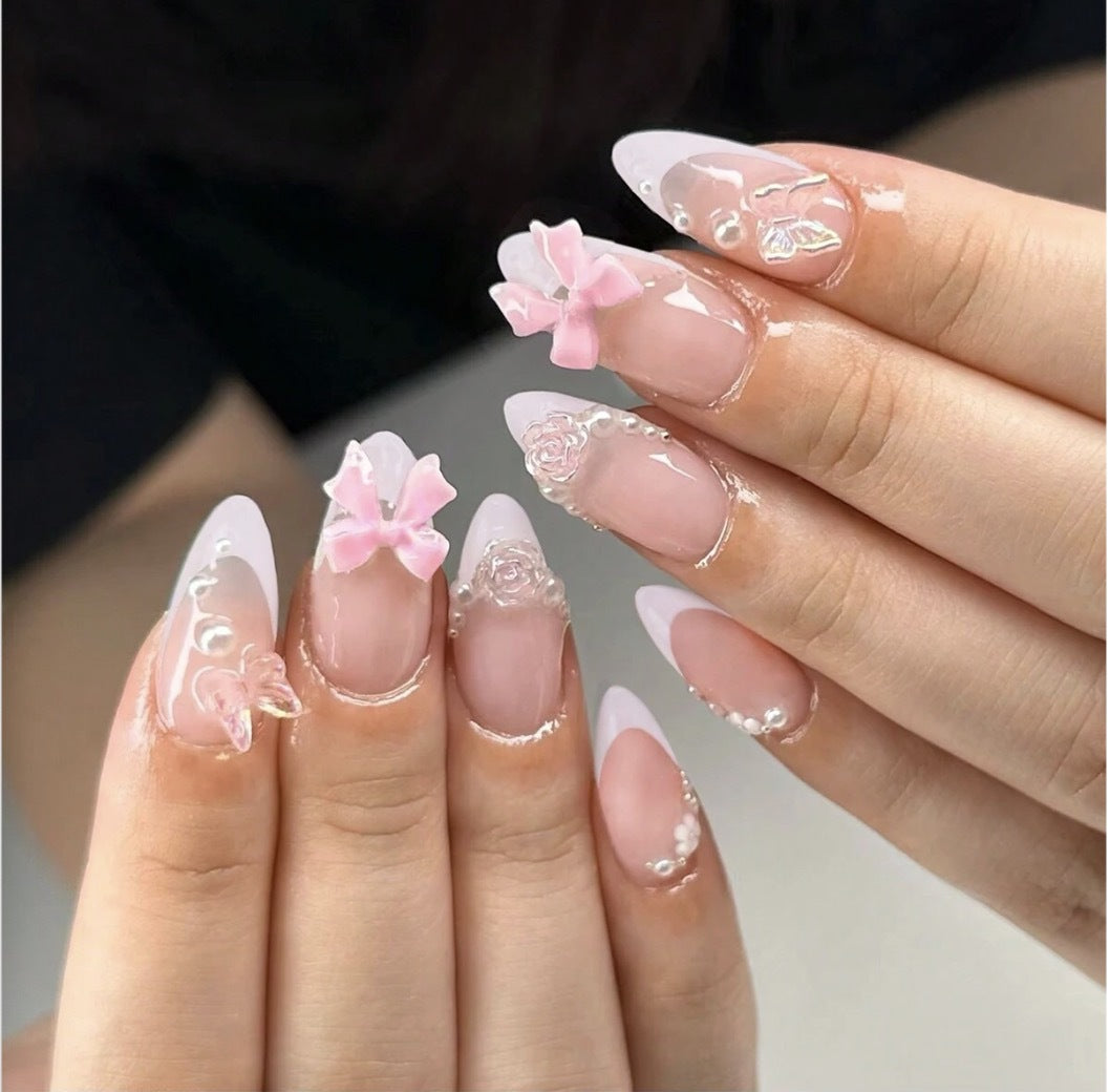 Artificial nail set with romantic flower and glitter accents Bowlift