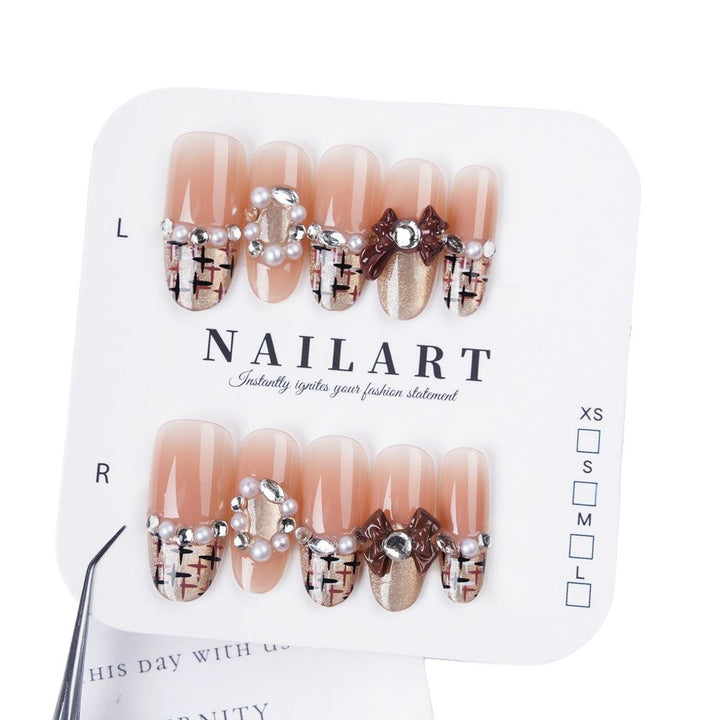 Artificial nails with glamorous decor Bowlift
