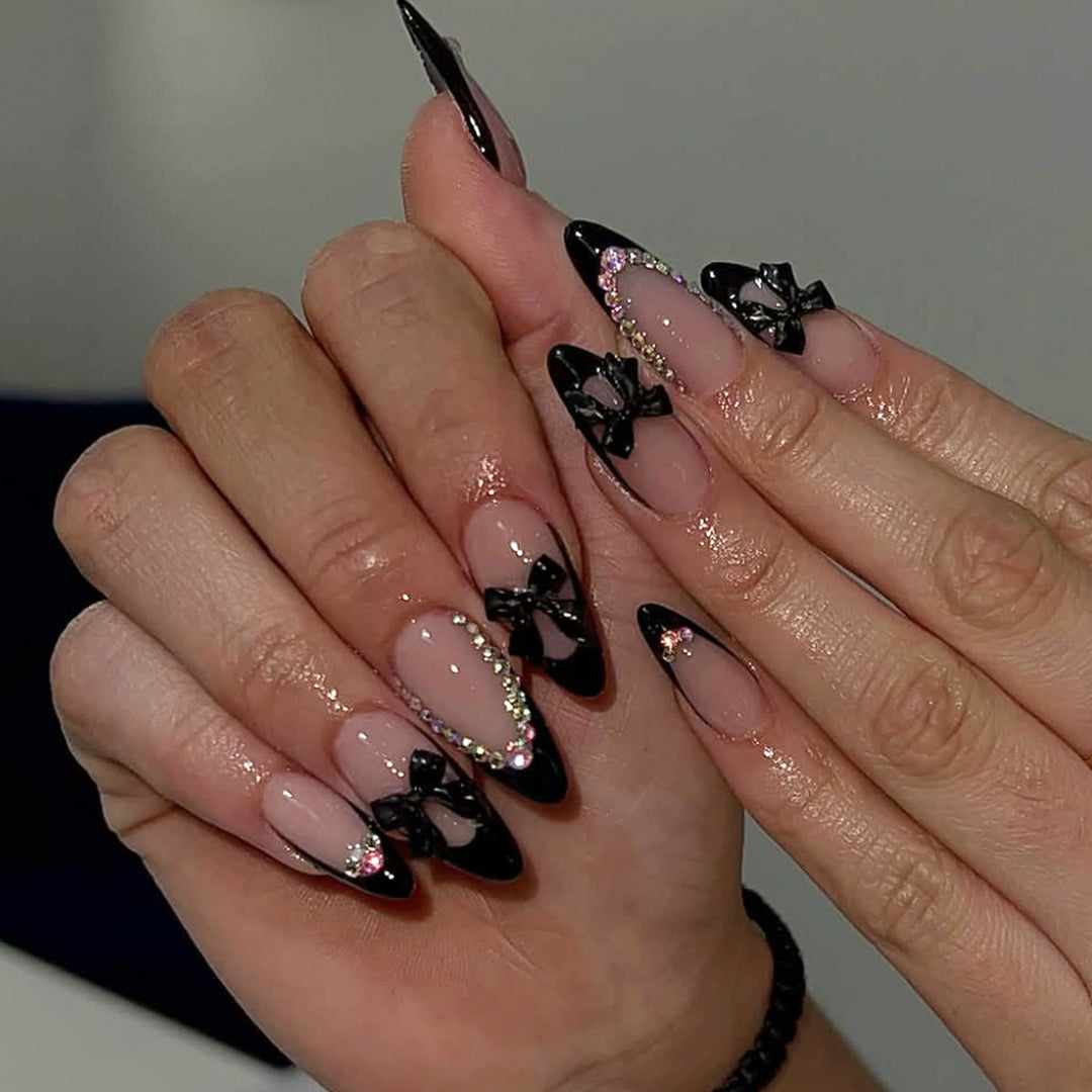 Elegant Stiletto Nail Design with Rhinestone Accents Bowlift