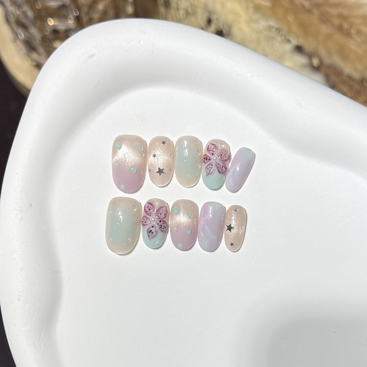 Floral-Inspired Press-On Nail Art Set with Star Accents Bowlift