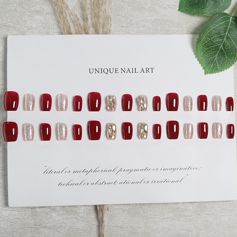 Artificial nail set with elegant glitter and metallic accents Bowlift