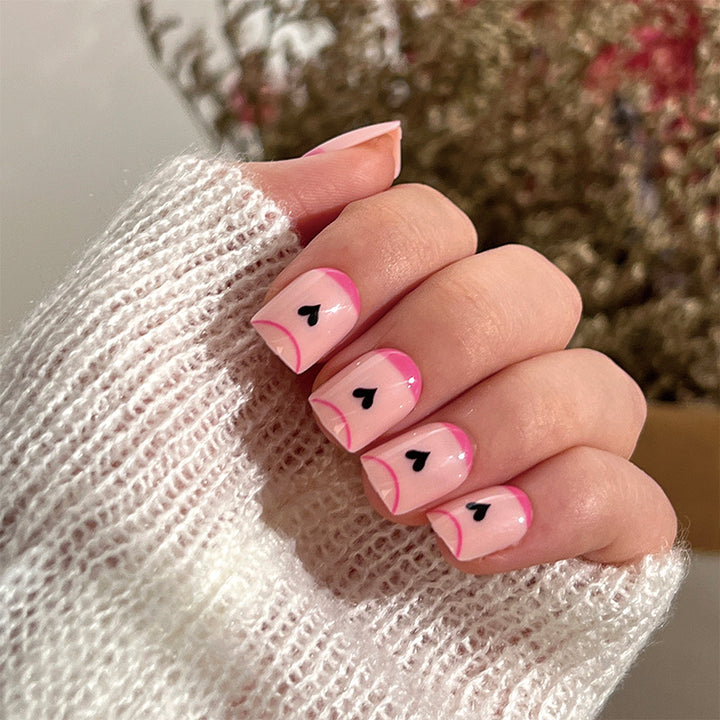 Creative Nail Art with Heart Design and Glitter Accents Bowlift