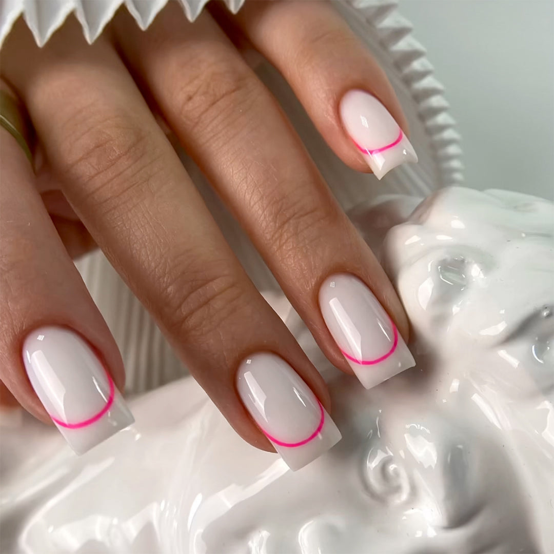 Stylish artificial nails with elegant French tip and modern accents Bowlift