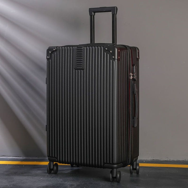 Hard shell suitcase with 360-degree wheel system and integrated safety feature Bowlift