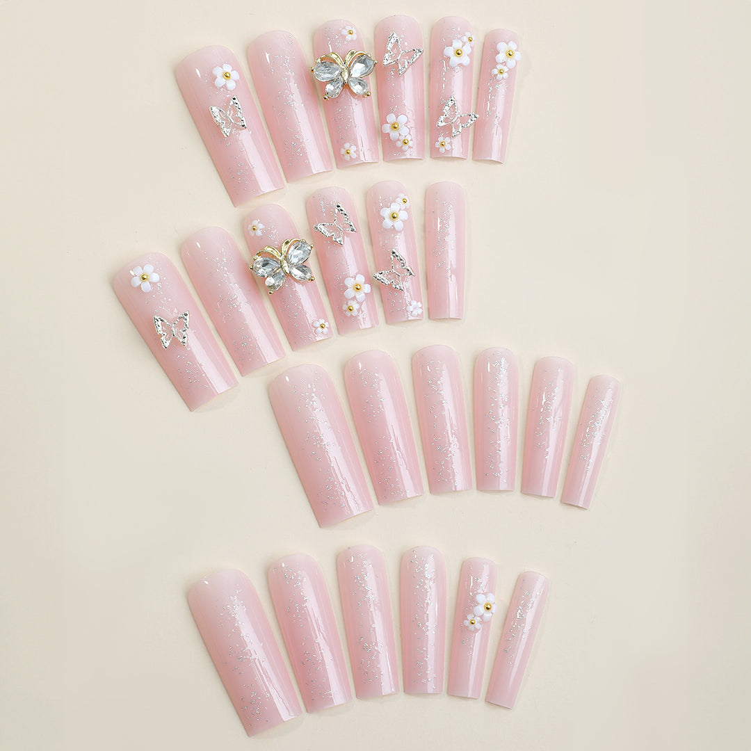 Artificial nail set with floral and glittering accents Bowlift