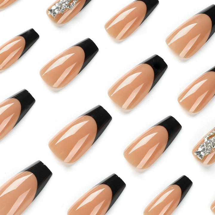 Glamorous artificial nails with rhinestones and black tips Bowlift