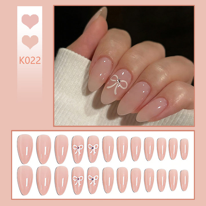 Acrylic nail set with elegant bow accents Bowlift