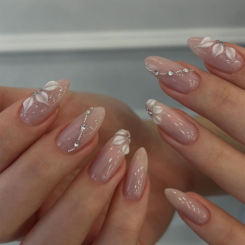 Artificial nail set with elegant flower designs and shimmering accents Bowlift