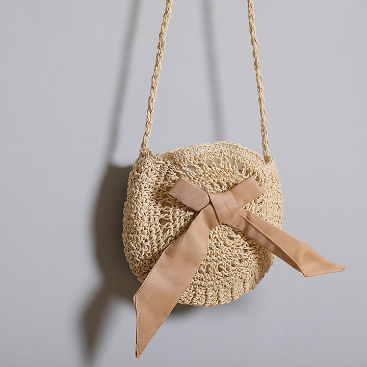 Handwoven shoulder bag with decorative bow accent Bowlift