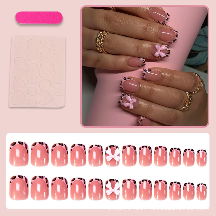 Nail set with playful bow design and lively animal accent Bowlift