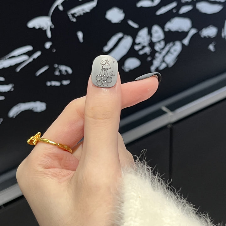 Artistic Press-On Nail Set with Whimsical Character Designs Bowlift