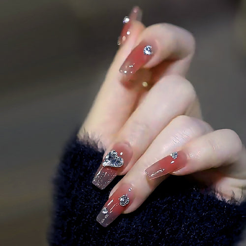 Acrylic nail set with elegant heart and rhinestone decorations Bowlift