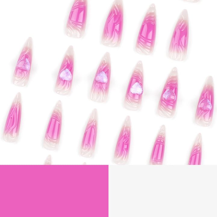 Artistic stiletto nails with heart design and glitter accents Bowlift