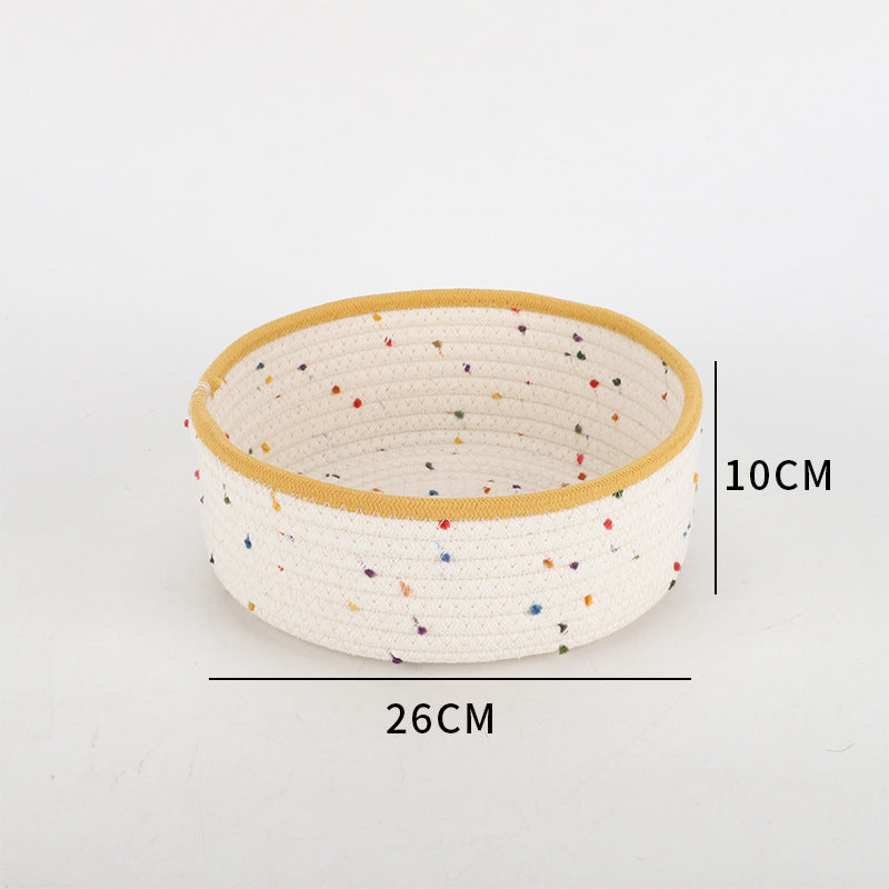 Storage basket made of natural cotton fabric with colorful dots