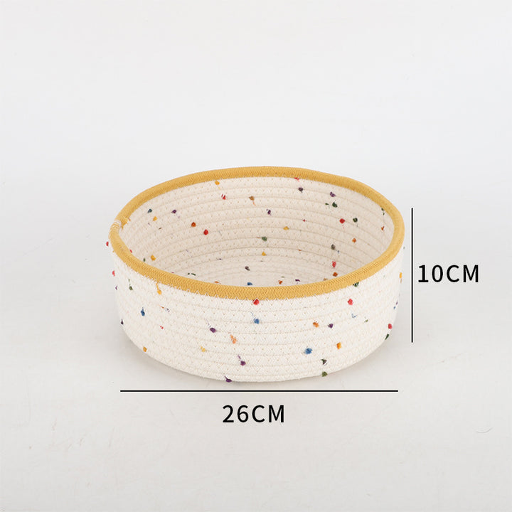 Storage basket made of natural cotton fabric with colorful dots