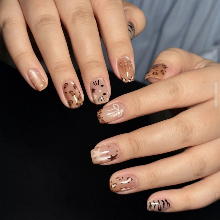 Artistic Press-On Nail Design with Gemstone Accents Bowlift