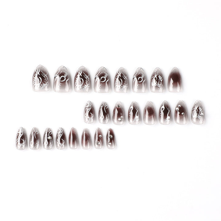 Artistic gel nails with delicate ornaments and glitter Bowlift
