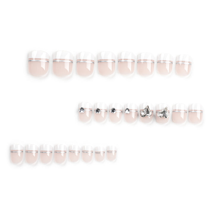 Elegant Nail Art with Glitter Accents and Jewelry Details Bowlift