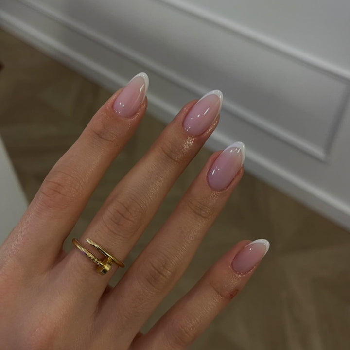 Artful nail extensions with elegant gradient and precise French tip Bowlift