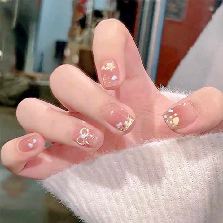 Artistic Press-On Nail Design with Gemstone Accents Bowlift