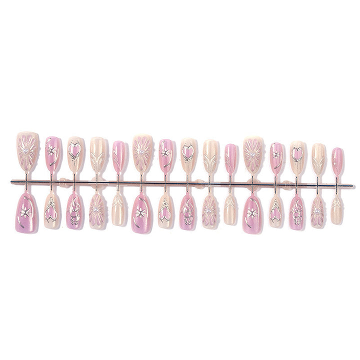 Acrylic nail set with floral accents and glitter embellishments Bowlift