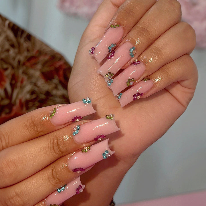 Artificial nail tips with colorful flower accents Bowlift