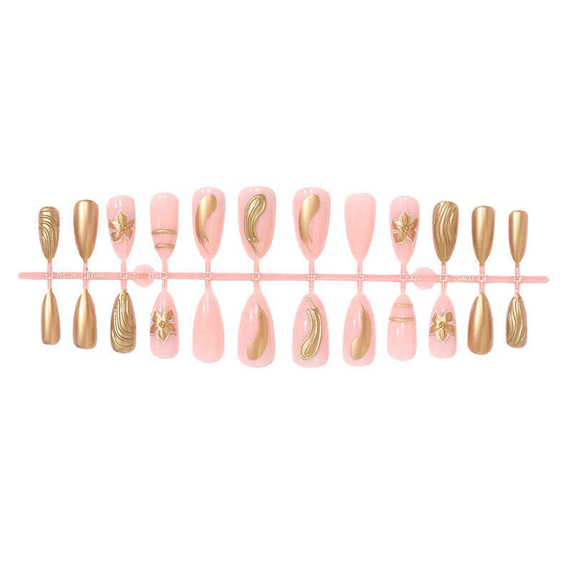 Creative nail art set with luxurious gold embellishments Bowlift