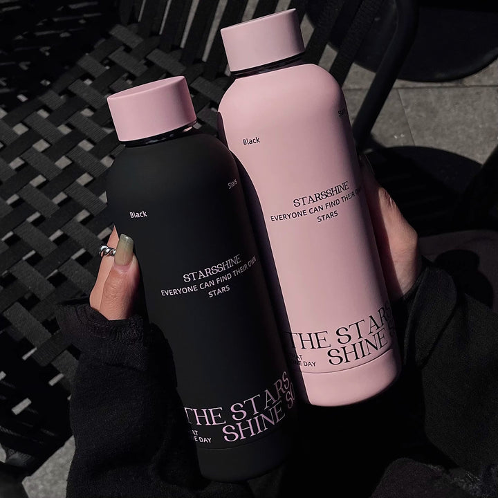 Women's insulated bottle with ergonomic design and practical carrying strap Bowlift