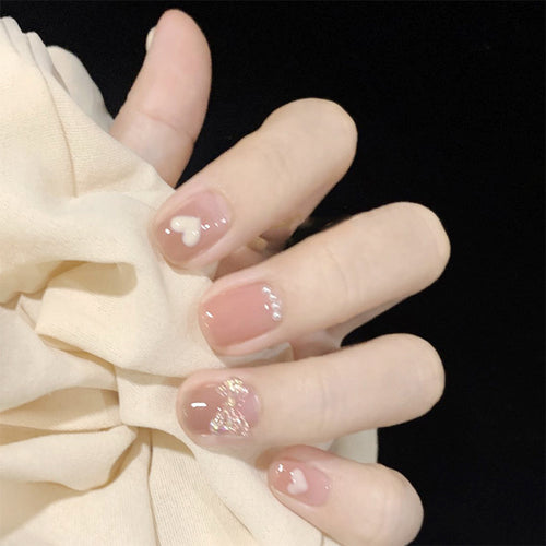 Artificial nails with romantic hearts and glitter accents Bowlift