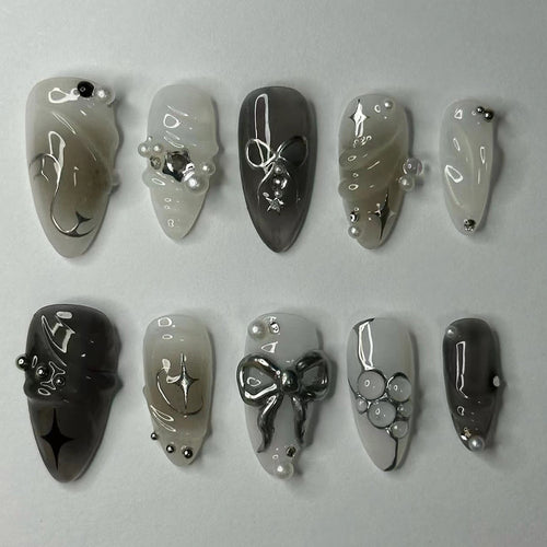 Elegant artificial nails with modern design and glitter accents Bowlift