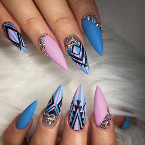 Artful stiletto nails with modern geometric designs and rhinestone embellishments Bowlift