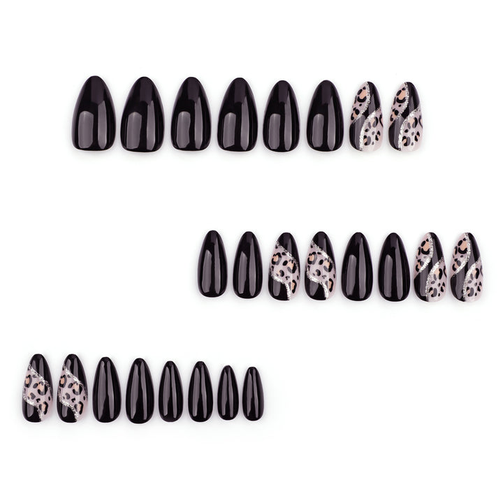Artistic stiletto nails with leopard design and glitter effects Bowlift