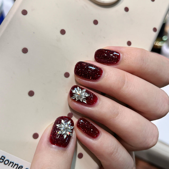 Glamorous artificial nails with rhinestone applications Bowlift