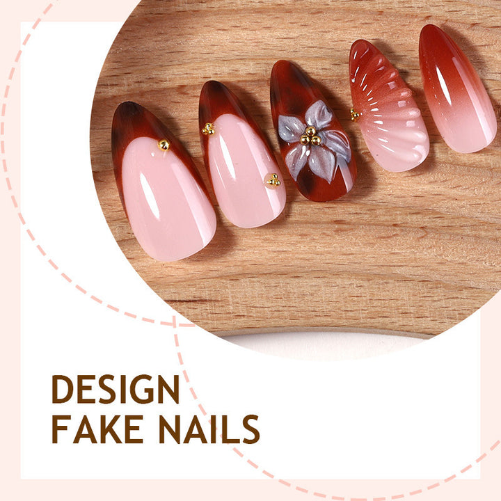 Nail art set with detailed ombre design and creative flower accents Bowlift