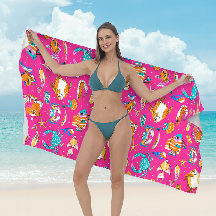 Beach towel with vibrant tropical plant motif Bowlift
