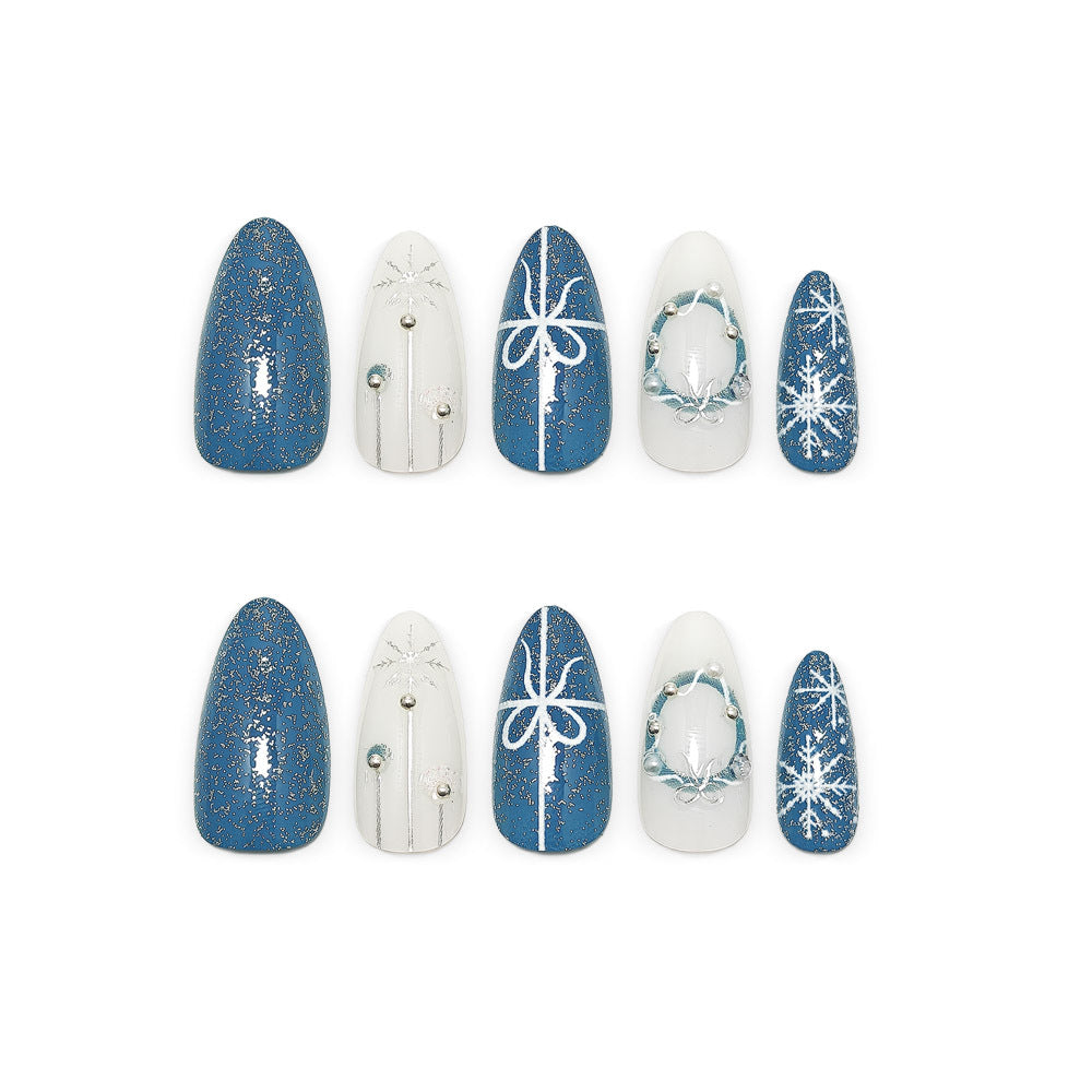 Artificial nails in elegant winter design with glitter accents Bowlift