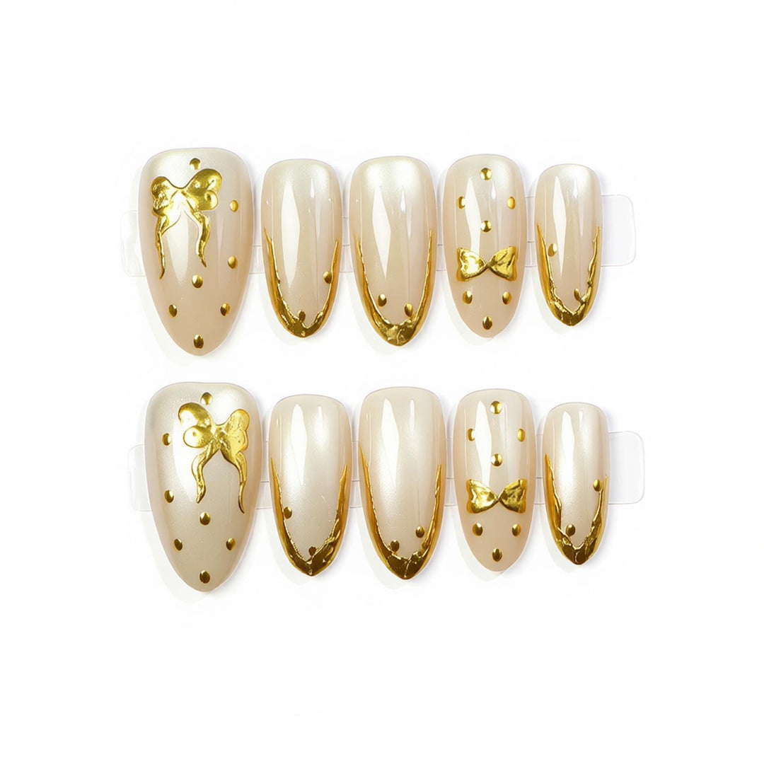 Elegant Press-On Nail Art with Golden Bow Accents Bowlift