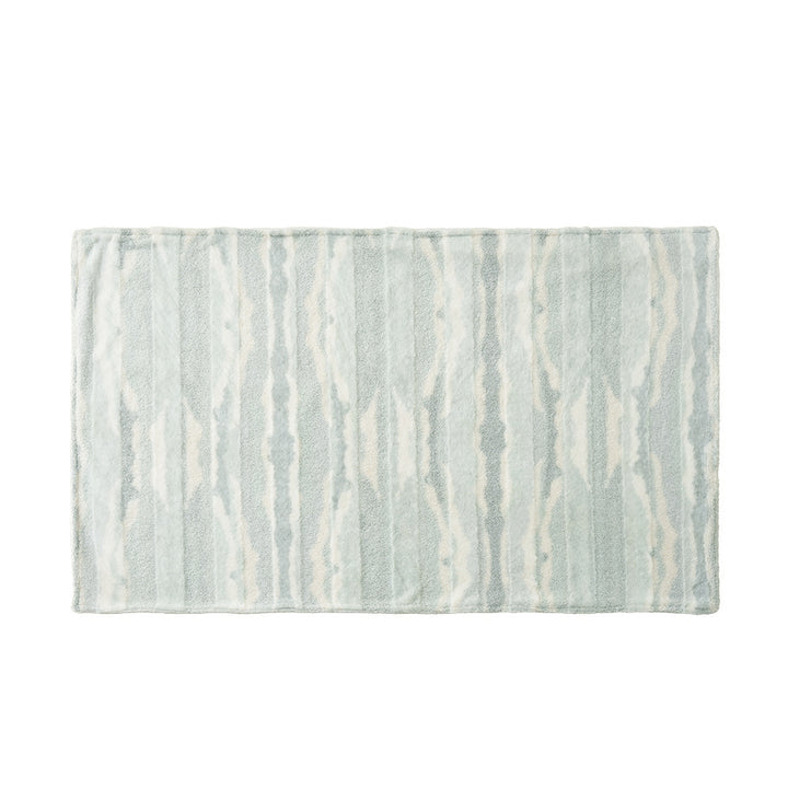 Rectangular high-pile bath mat with wavy stripe relief