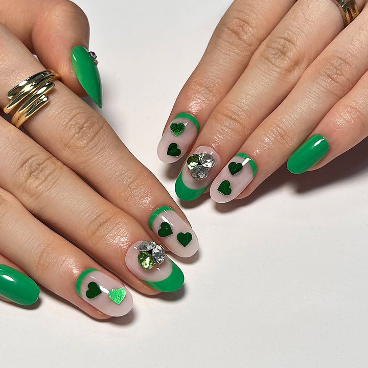 Artistic Nail Extensions with Lovable Heart Patterns and Glitter Accents Bowlift