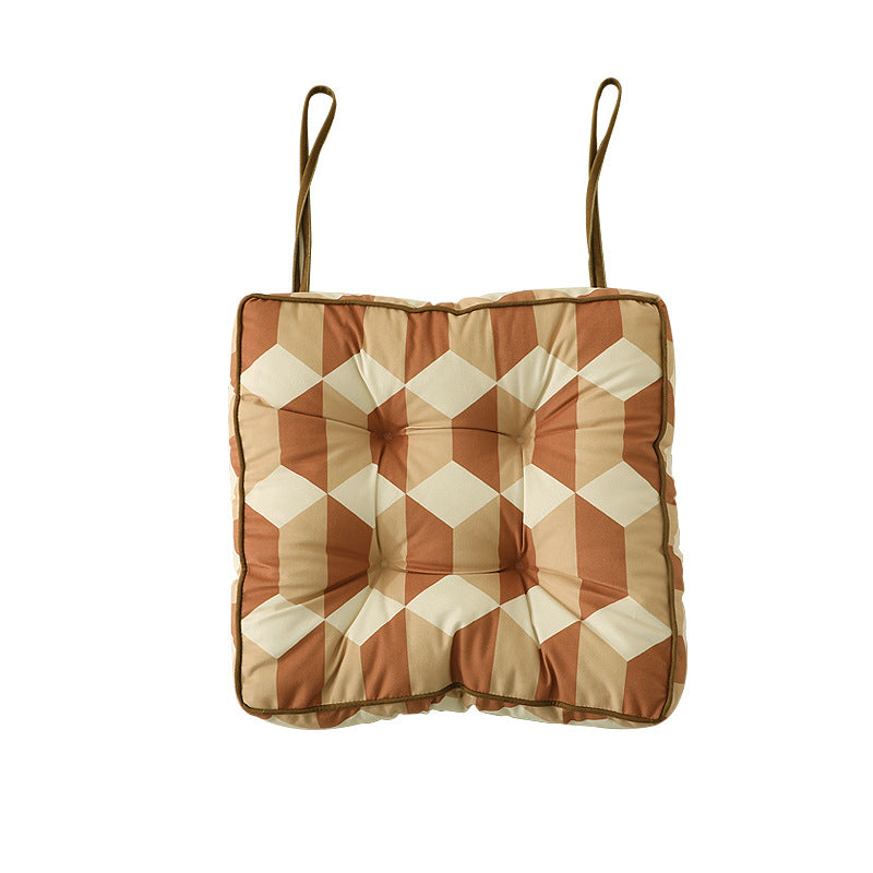 Padded chair cushion with ties and quilted tufted upholstery