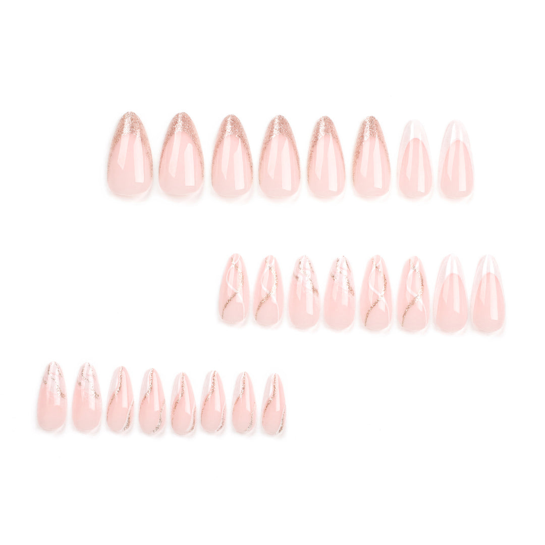 Artful stiletto nails with elegant marble and glitter design Bowlift