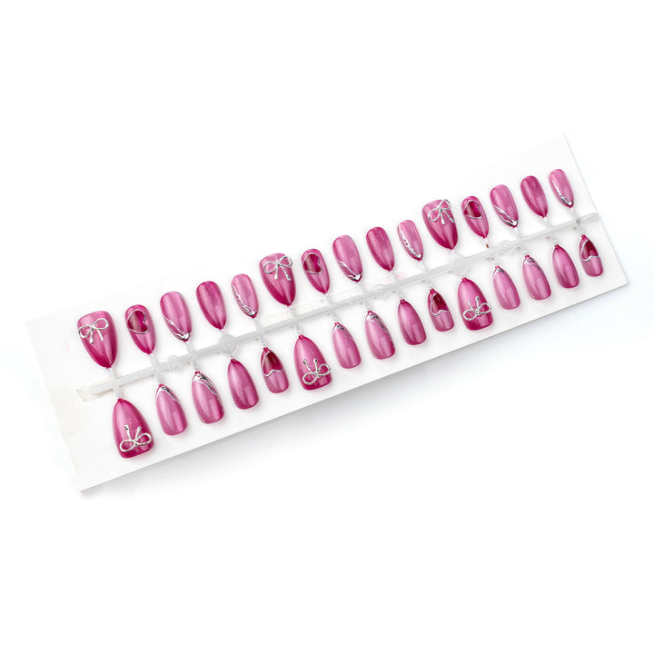 Acrylic nail set with elegant heart and bow decorations Bowlift