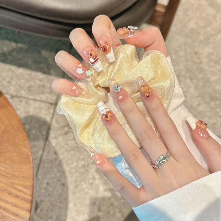 Artificial nail set with charming animal design and sparkling crystal embellishments Bowlift